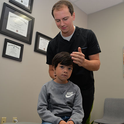 Adjusting young boy