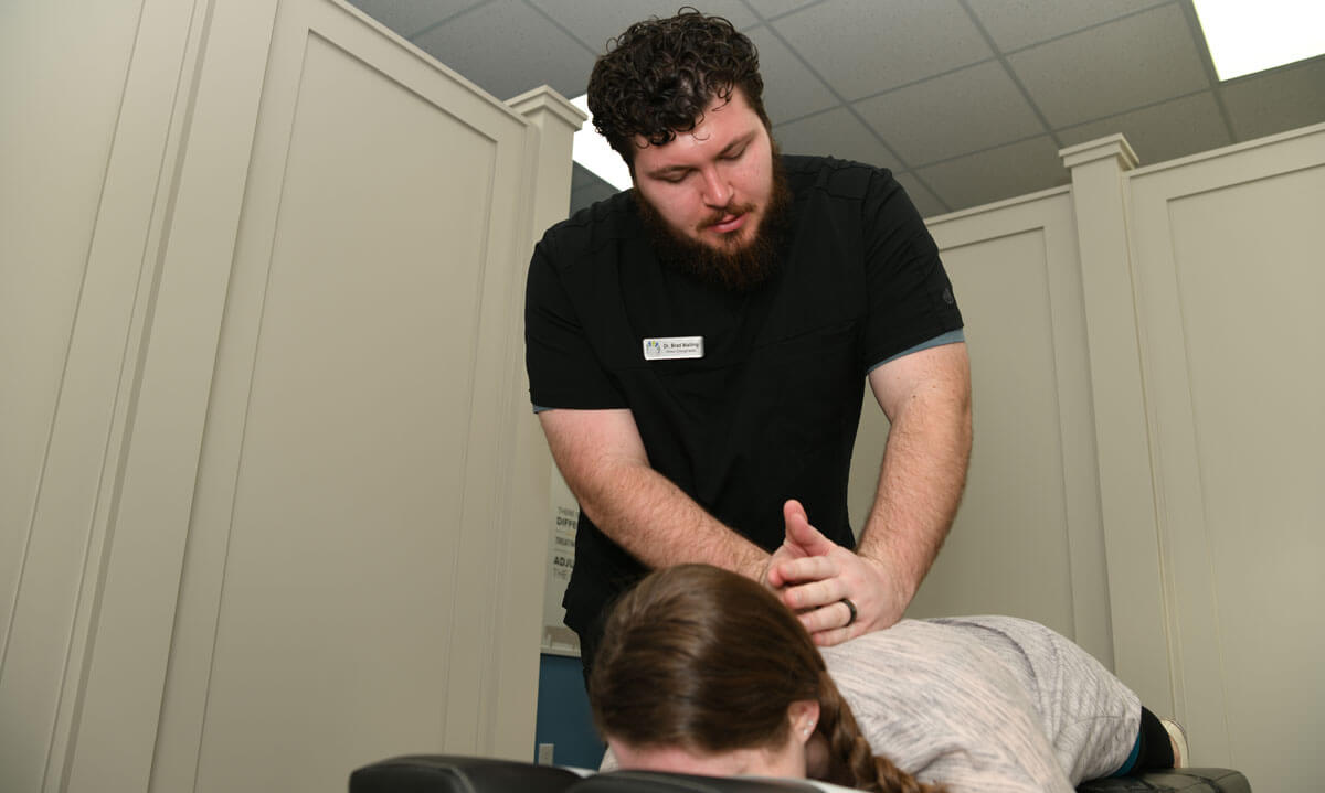 Dr. Brad performing back adjustment