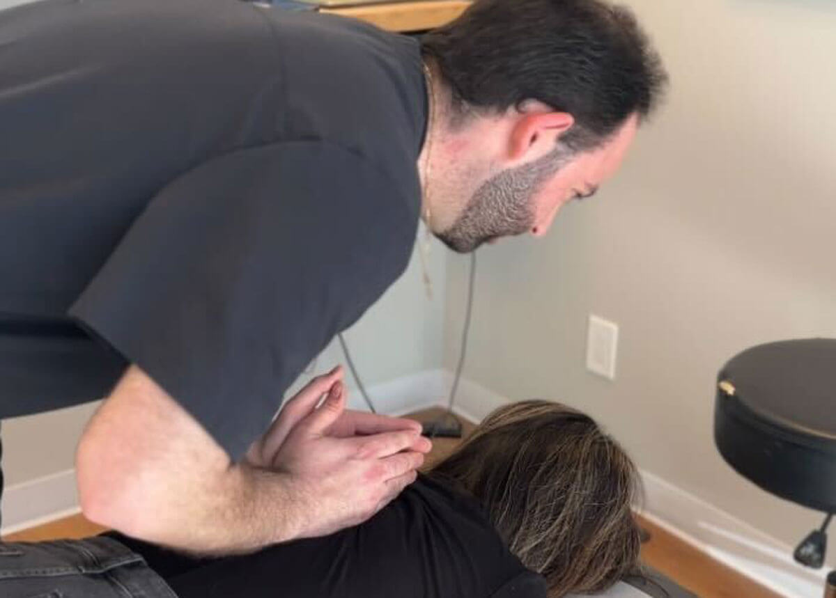 Dr. Ryan performing manual therapy