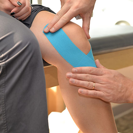Athletic taping knee closeup